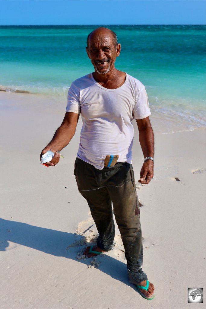 A fisherman at Hala Beach, showing me his catch - which went straight into his pocket.