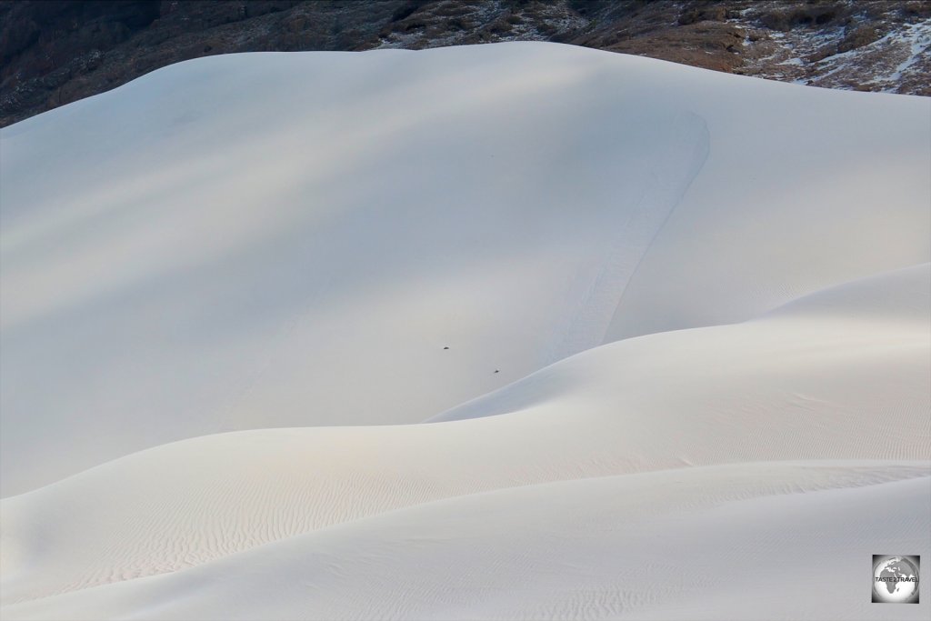 The sand dunes at Arher beach are 150 metres (500 ft) in height).