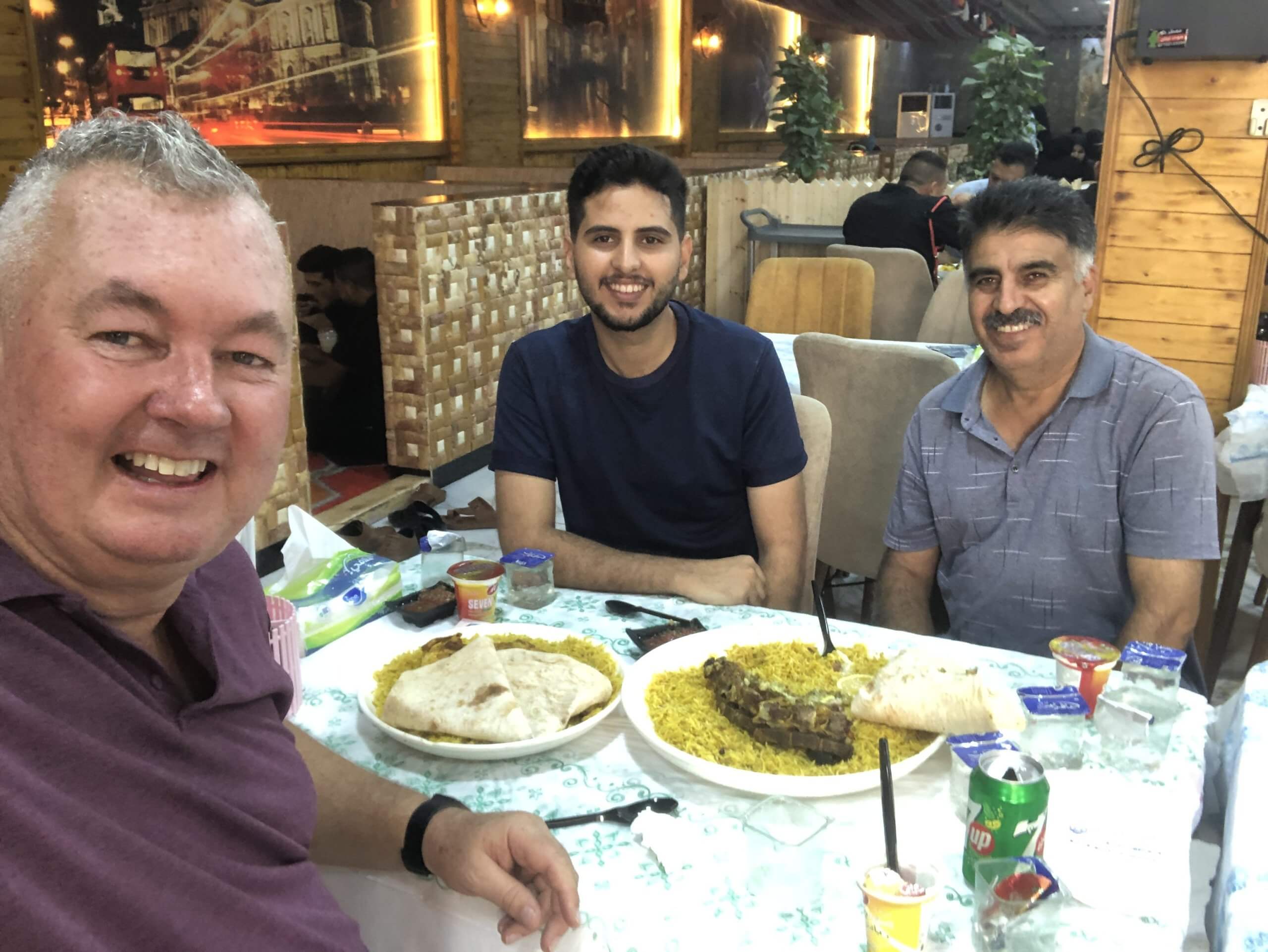 Sharing a typical Iraqi lunch of rice and goat with Fahad and his uncle in a restaurant in Hillah. 