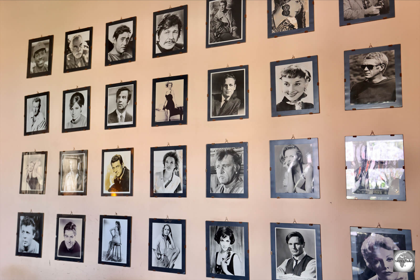 Photos of legendary stars line the walls of Cinema Roma. 