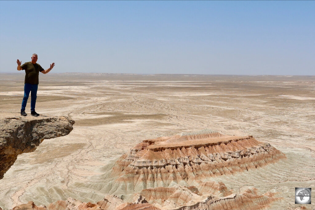 Standing on the edge at the Yangykala Canyon.