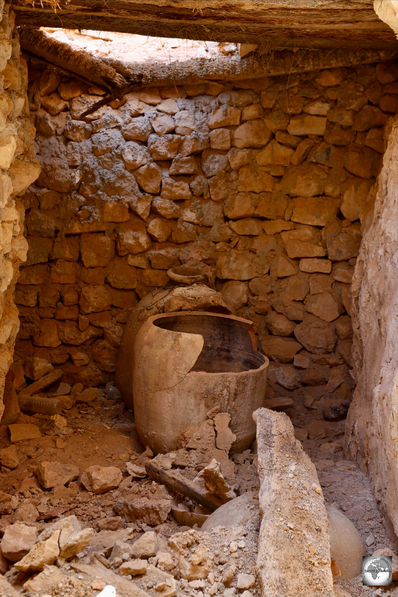 Ancient terracotta pots, which one held olive oil, remain inside once of the chambers at Kabaw. 