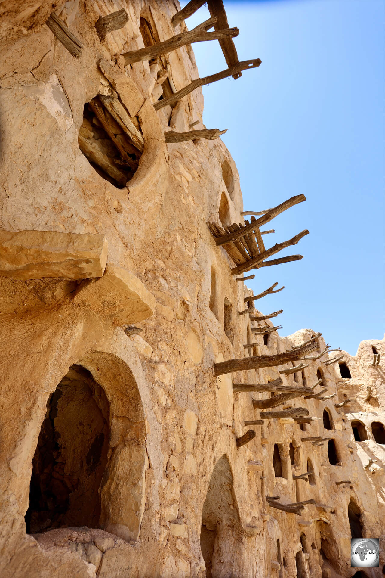 Tree branches, embedded into the mud wall of the granary, were used as a ladder to access higher chambers.