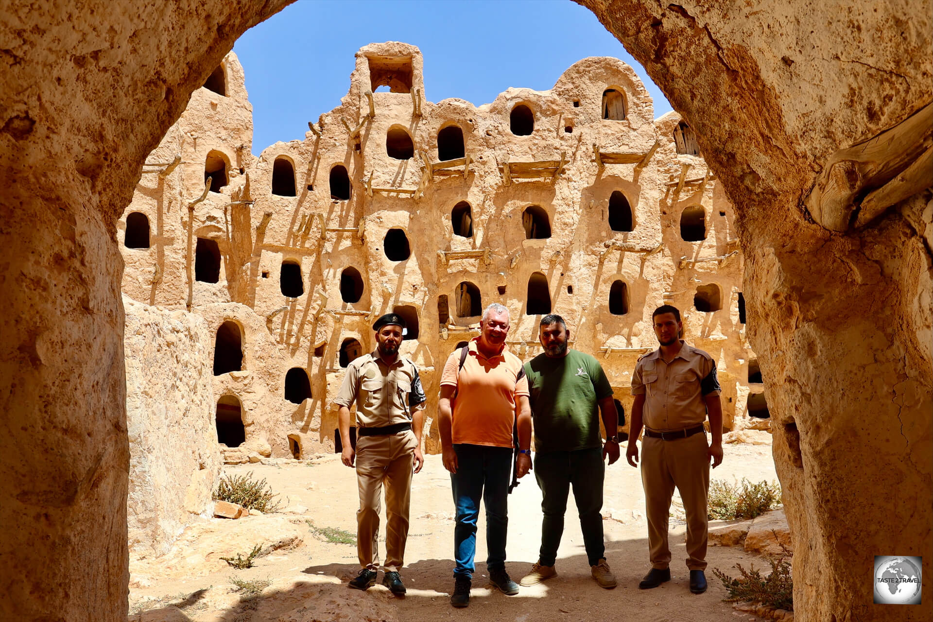 A photo of myself, my police escort, and the two tourist police who are responsible for the Kabaw fortified granary.