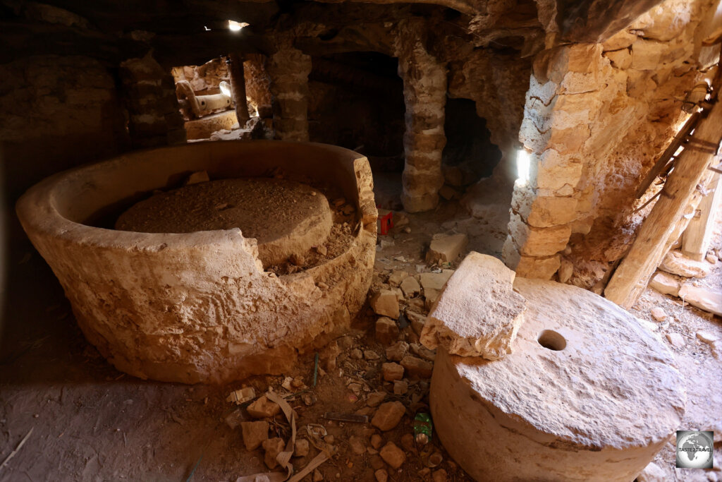 The remnants of an ancient olive oil press remain inside one of the buildings at Tormisa.