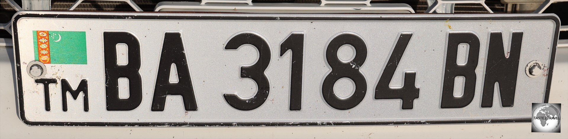 Car license plates in Turkmenistan are suffixed with a two-letter region code, such as this one, which is from the Balkan (BN) region.