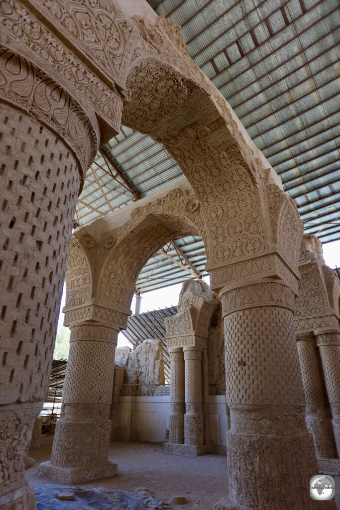 The 'Mosque of the Nine Cupolas' features deeply carved stucco design.