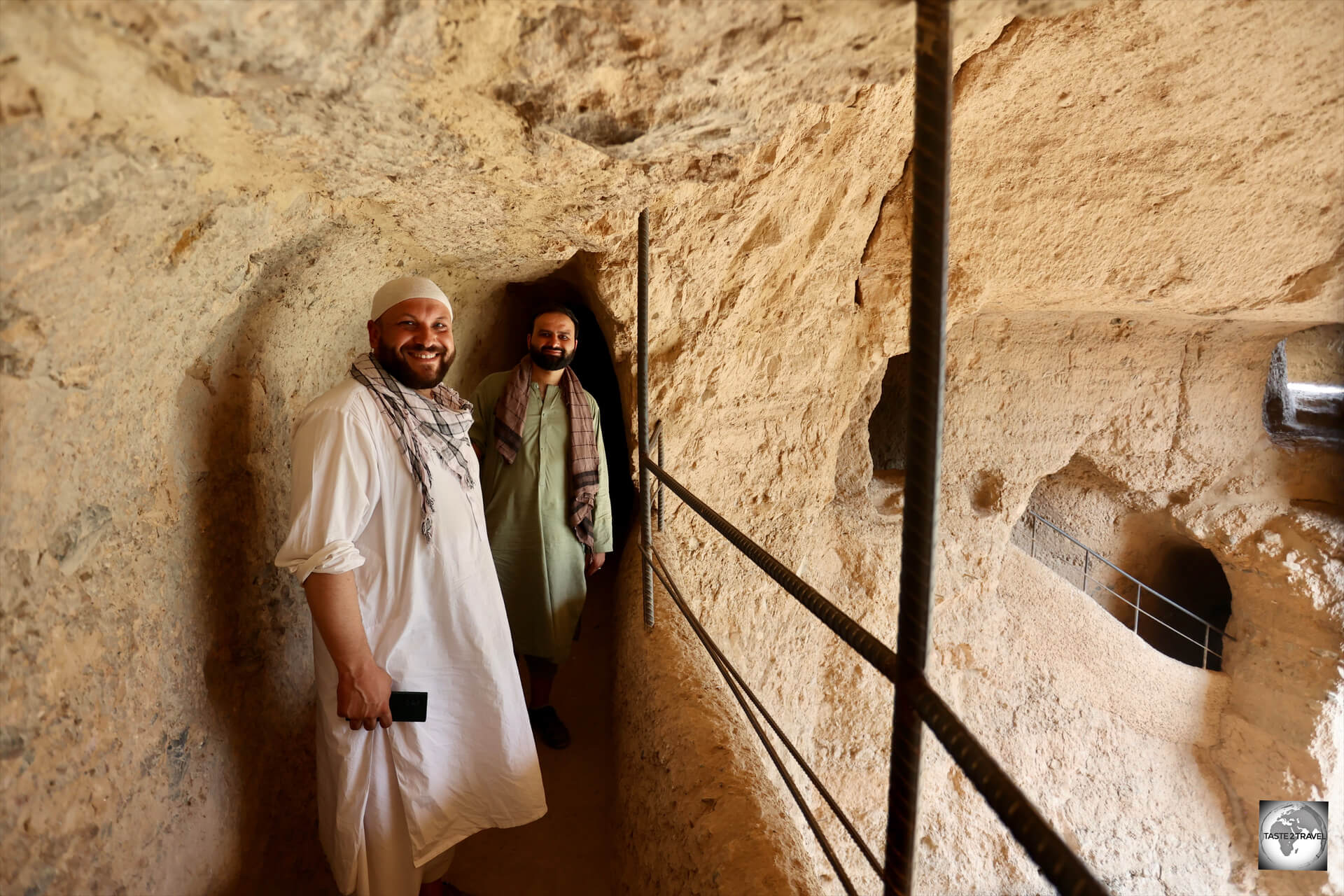 Exploring one of the niches of the (former) giant Buddhas at Bamyan with my guide, Jamshyd Aryan, and our driver, Omar. 