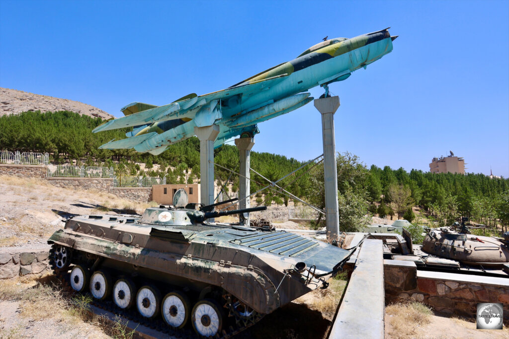 A captured Soviet tank and a fighter jet, on display at the Jihad Museum.