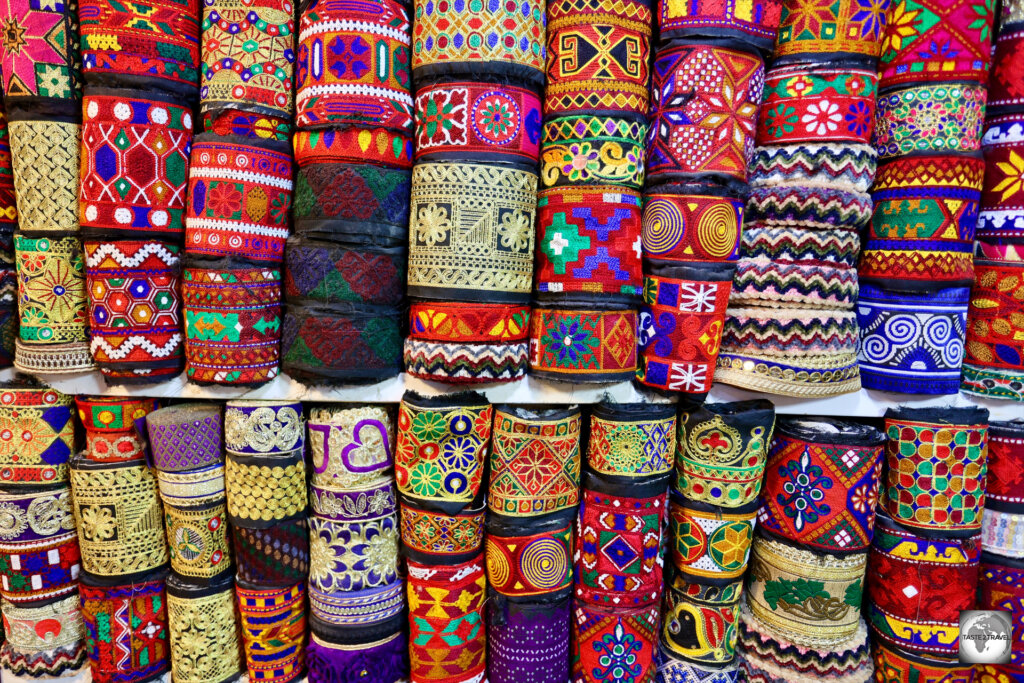 Colourful, hand-woven, rolls of textiles on sale at Herat Bazaar.