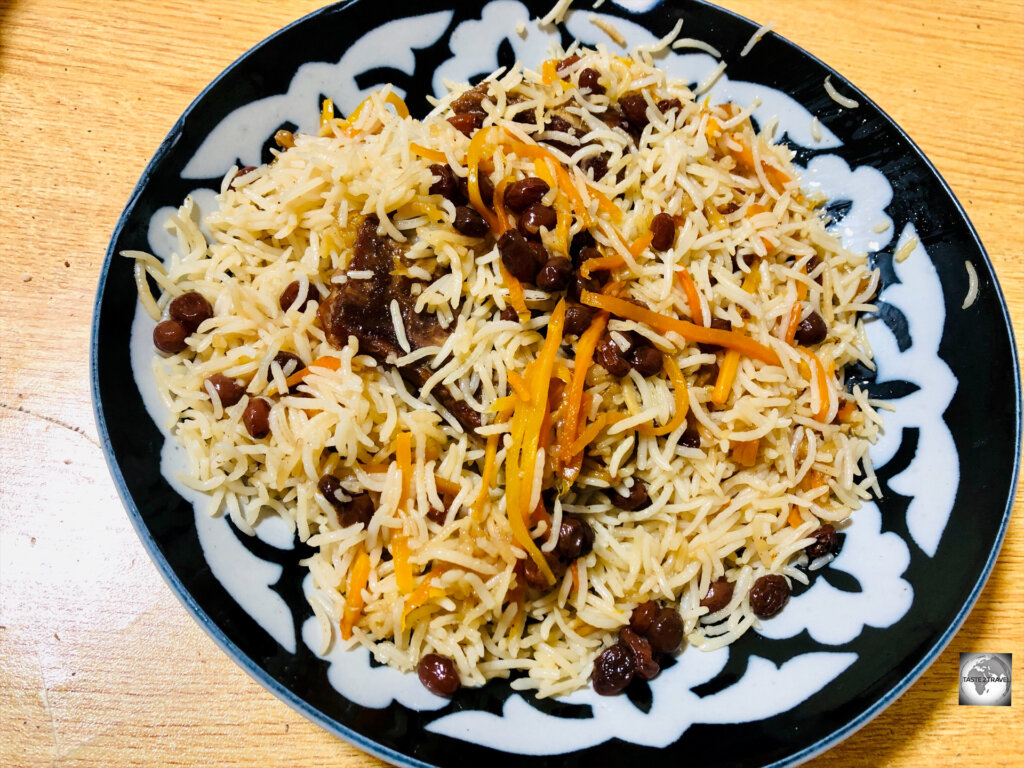 Enjoying a plate of Kabuli Pulao in Kabul.