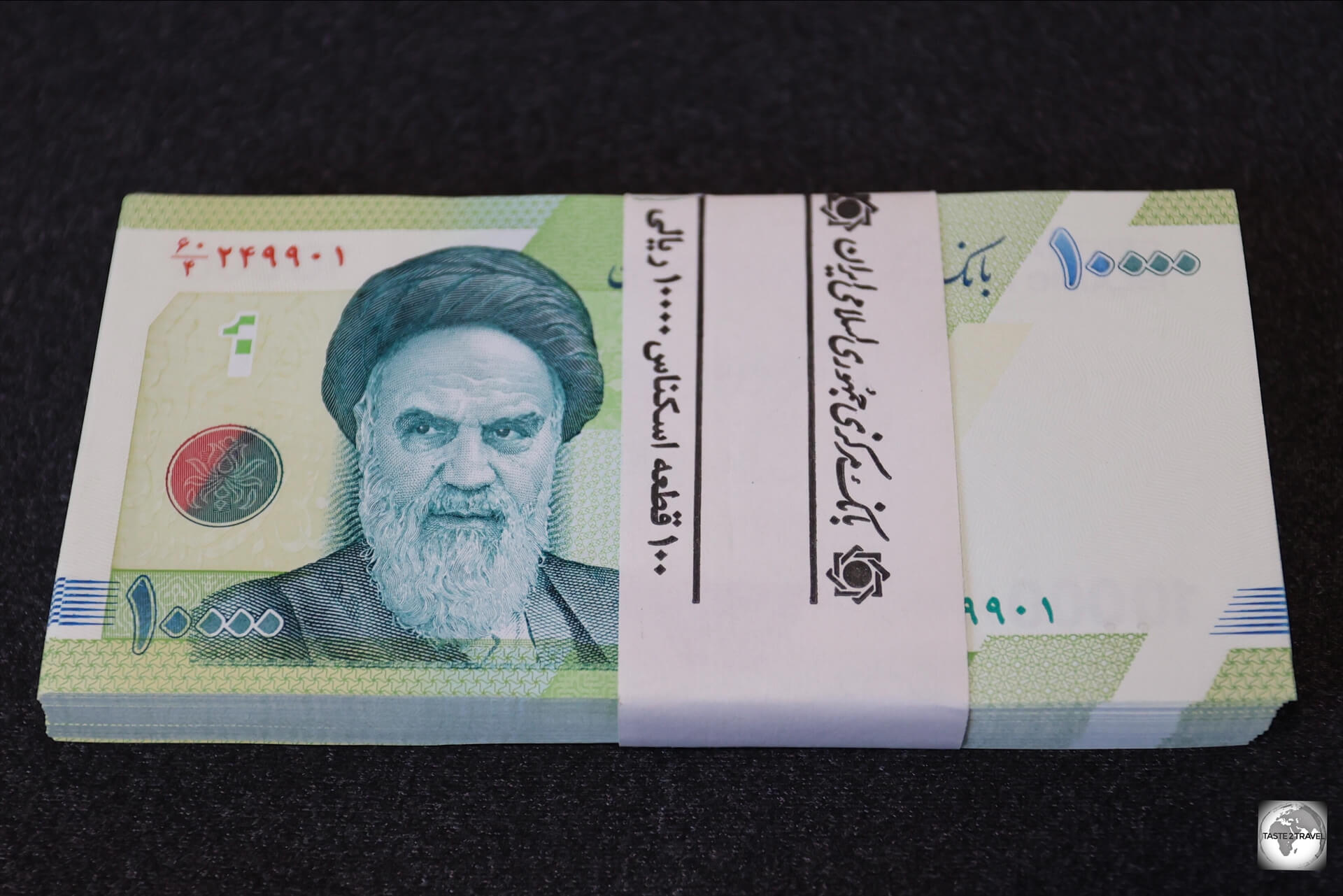 My uncirculated wad of one hundred, 10,000 Iranian rial, banknotes which I purchased from a money changer. 