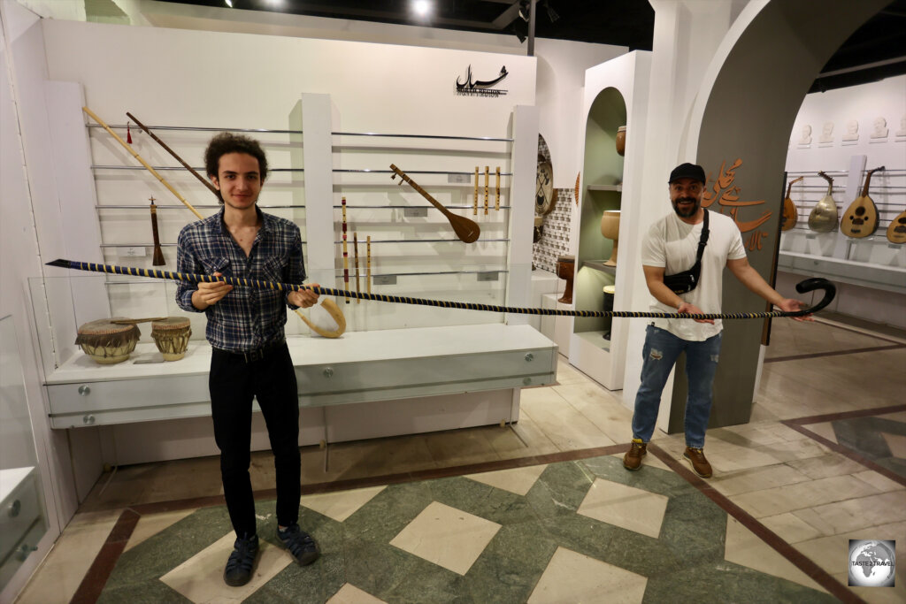 The guide from the Esfahan Music Museum (left), and my regular guide, Essi, holding a very long Iranian horn instrument,