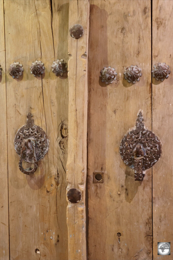 Traditional wooden doors in Iran feature two door knockers - the one on the left is to be used by female visitors, while the one on the right is to be used by male visitors. Each produces a different sound.