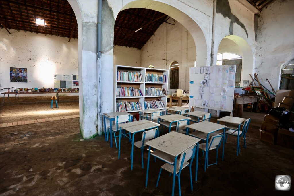 A community library, and classroom, have been installed inside the former production facility at Roça Água Izé.