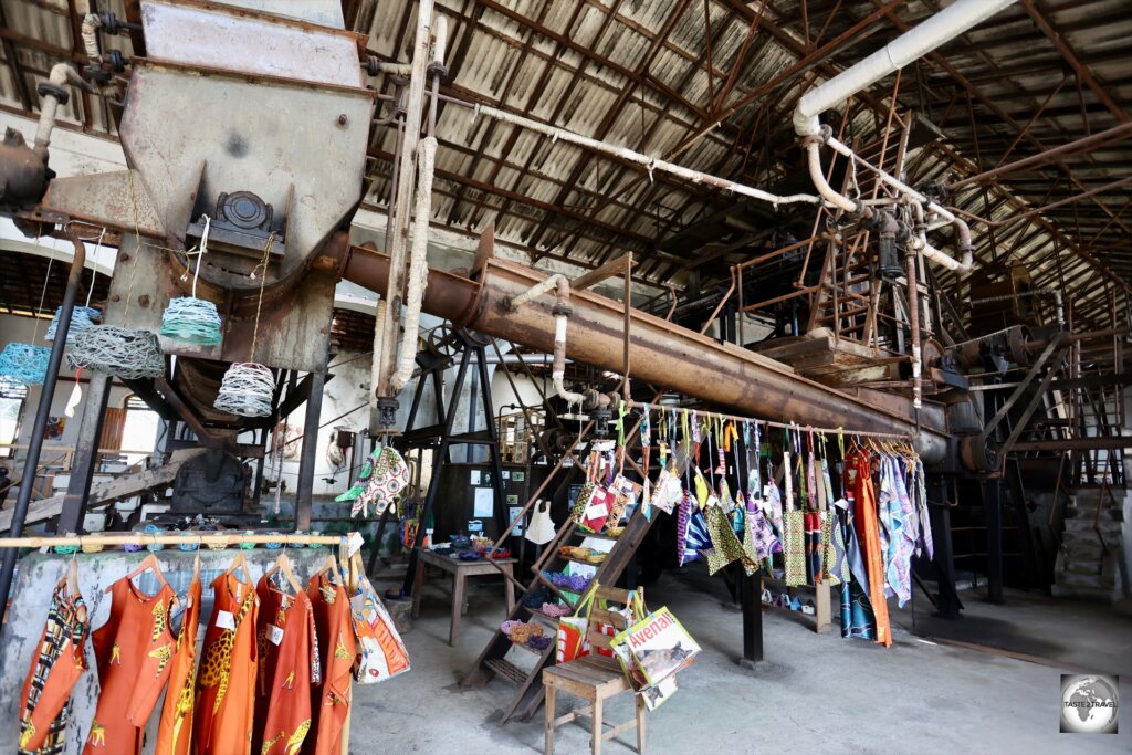 An artisanal shop has been installed around the old processing equipment at Roça Água Izé.