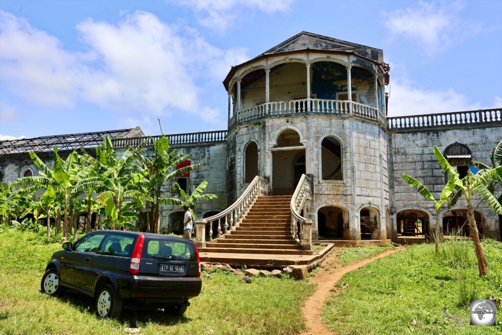 My rental car parked outside the abandoned Roça de Água Izé Hospital, once rated as the best hospital in central Africa.