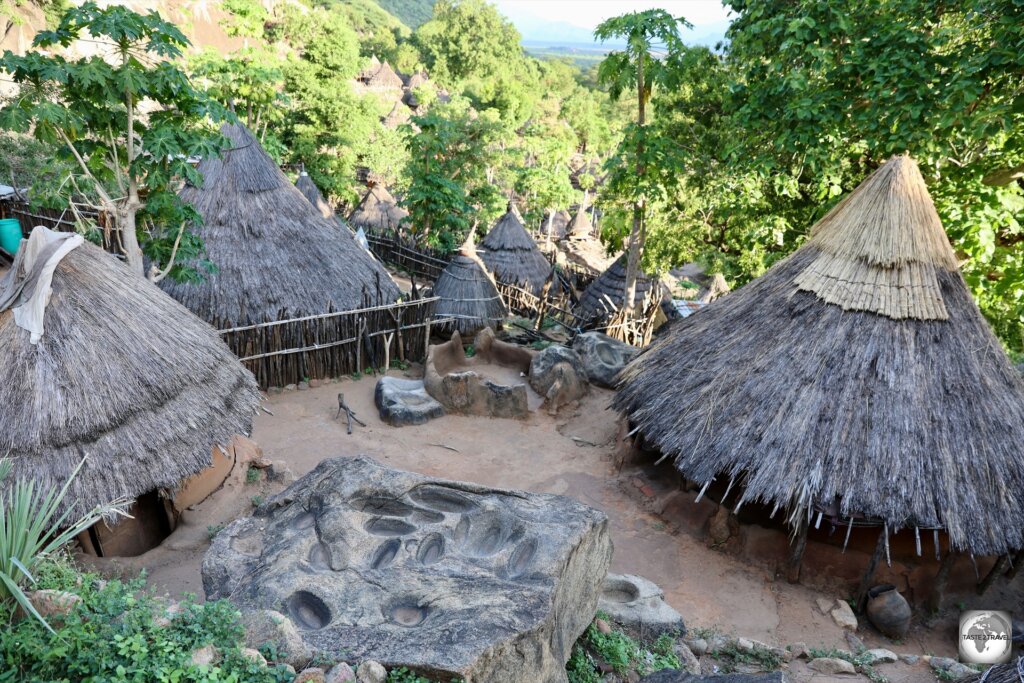 A grinding stone in a village compound.