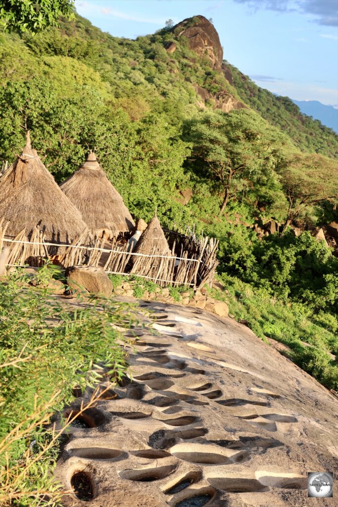 A large grinding stone and views of Ilieu village.