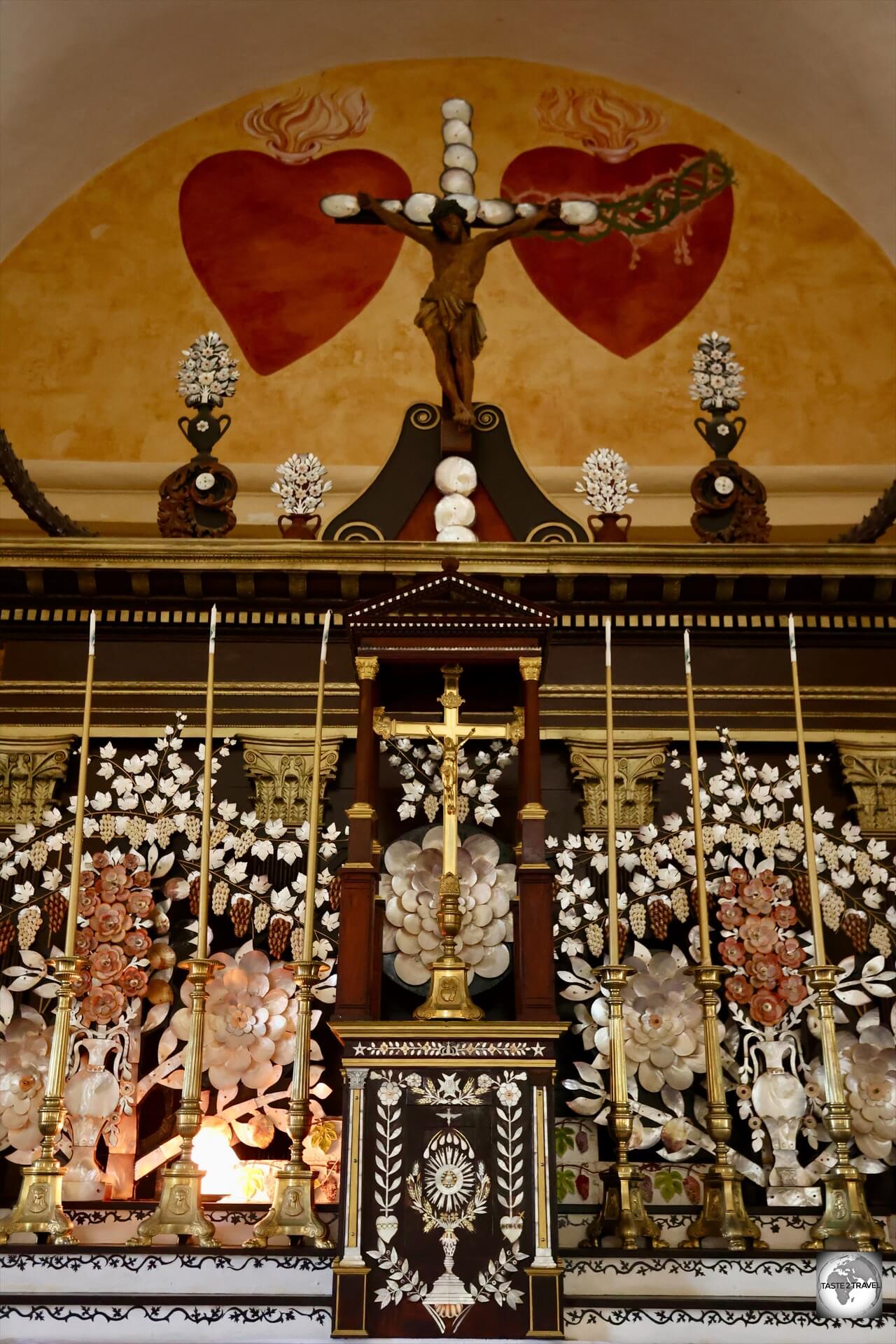 A highlight of Mangareva is the ornate altar at St. Michael's Cathedral, which is adorned with mother-of-pearl and black pearls.