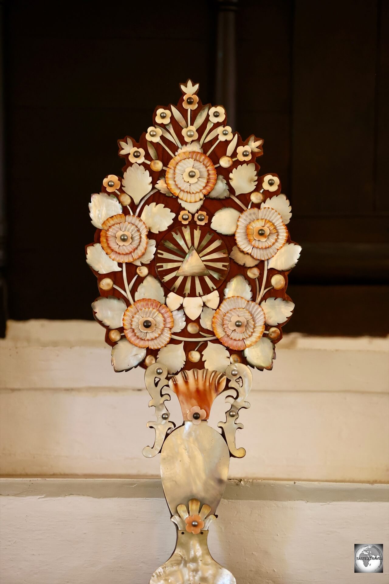 Mother-of-pearl flowers, with black pearls at their centre, decorate the altar at St. Michael's Cathedral in Rikitea.