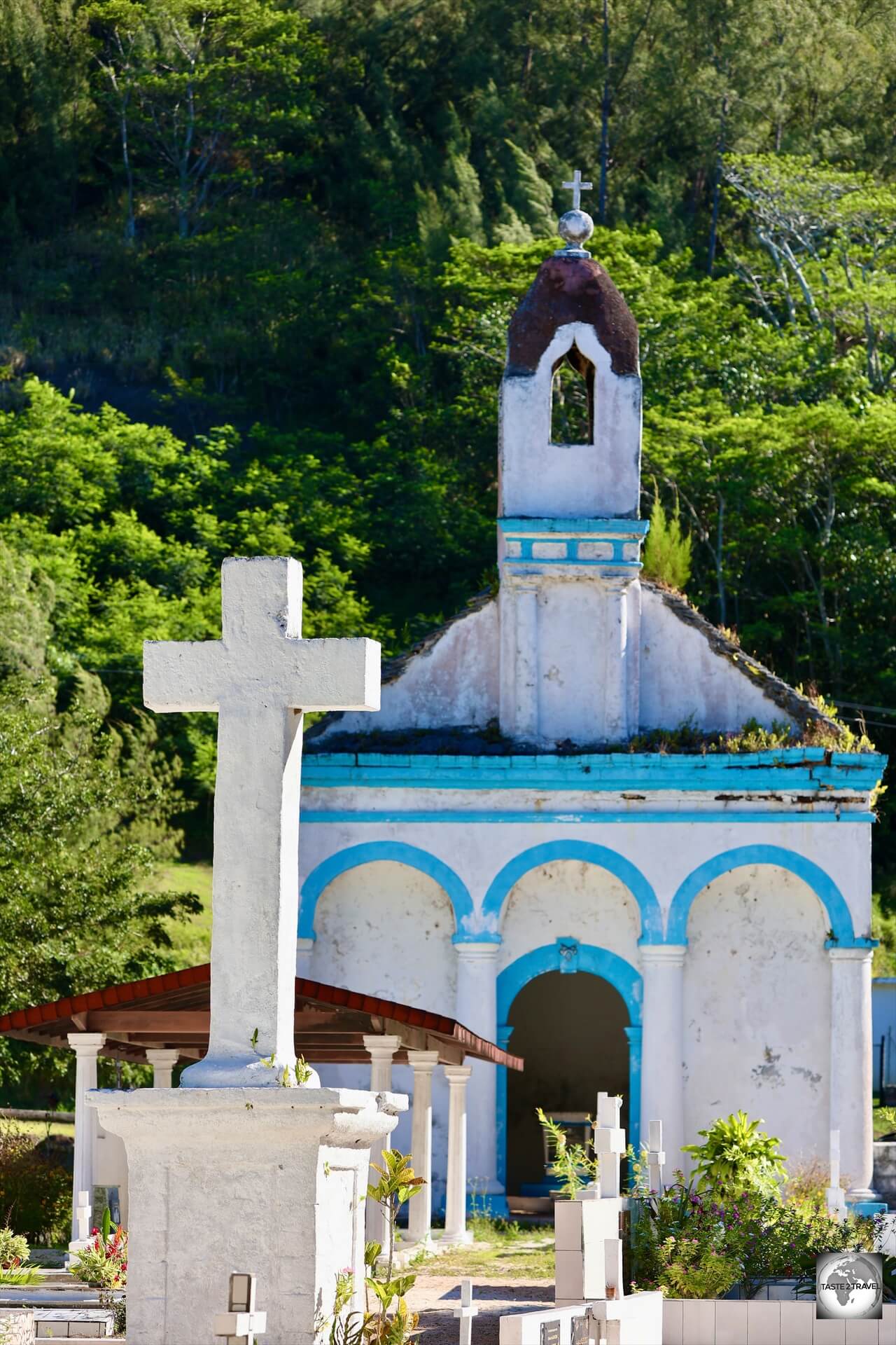 A view of St. Pierre's Chapel, the burial site of King Te Ma-puteoa, and the cemetery in Rikitea.