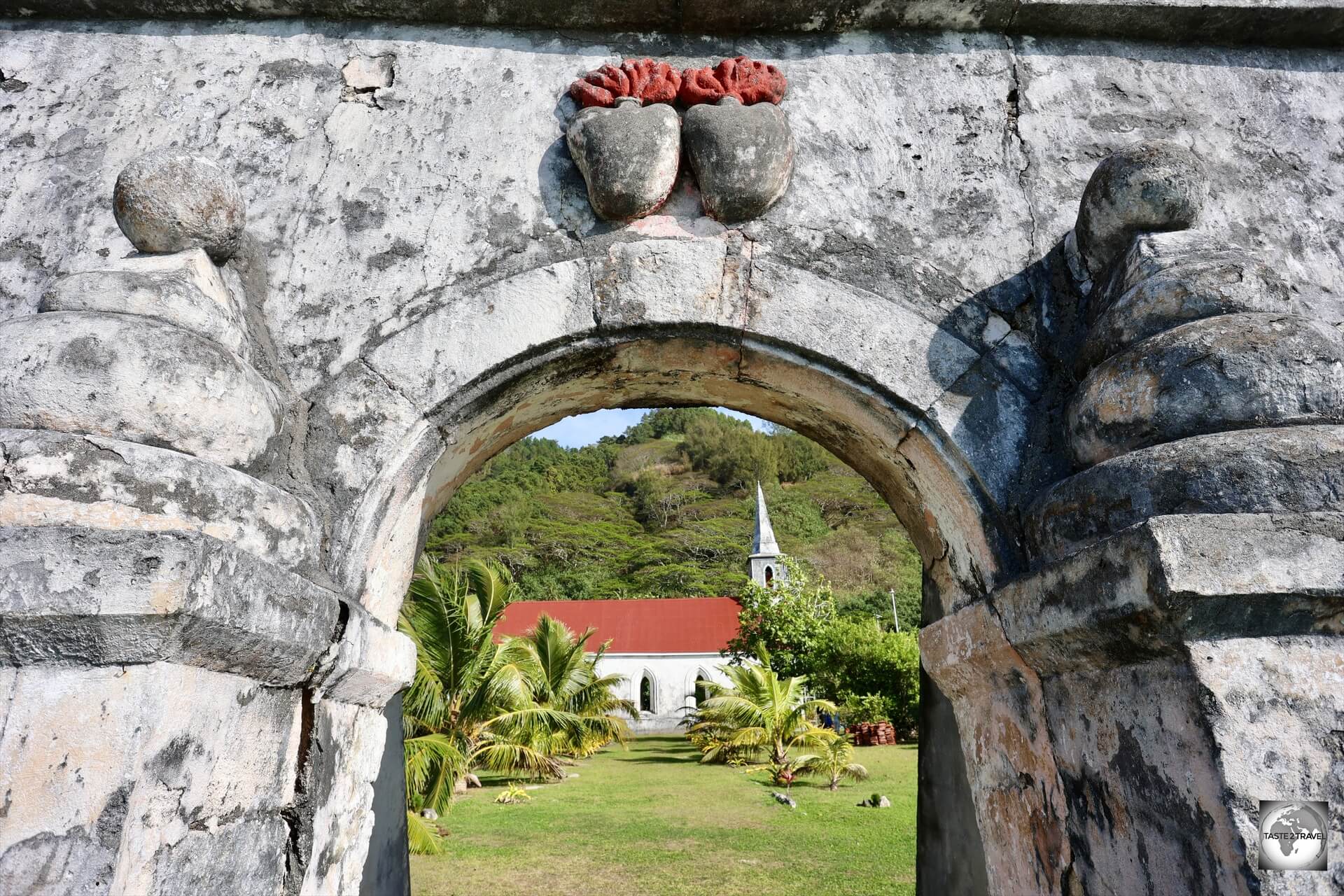 Church of Saint-Gabriel, and the archway with the twin hearts from ‘Les Sacrés-Coeurs de Picpus', Taravai Island.