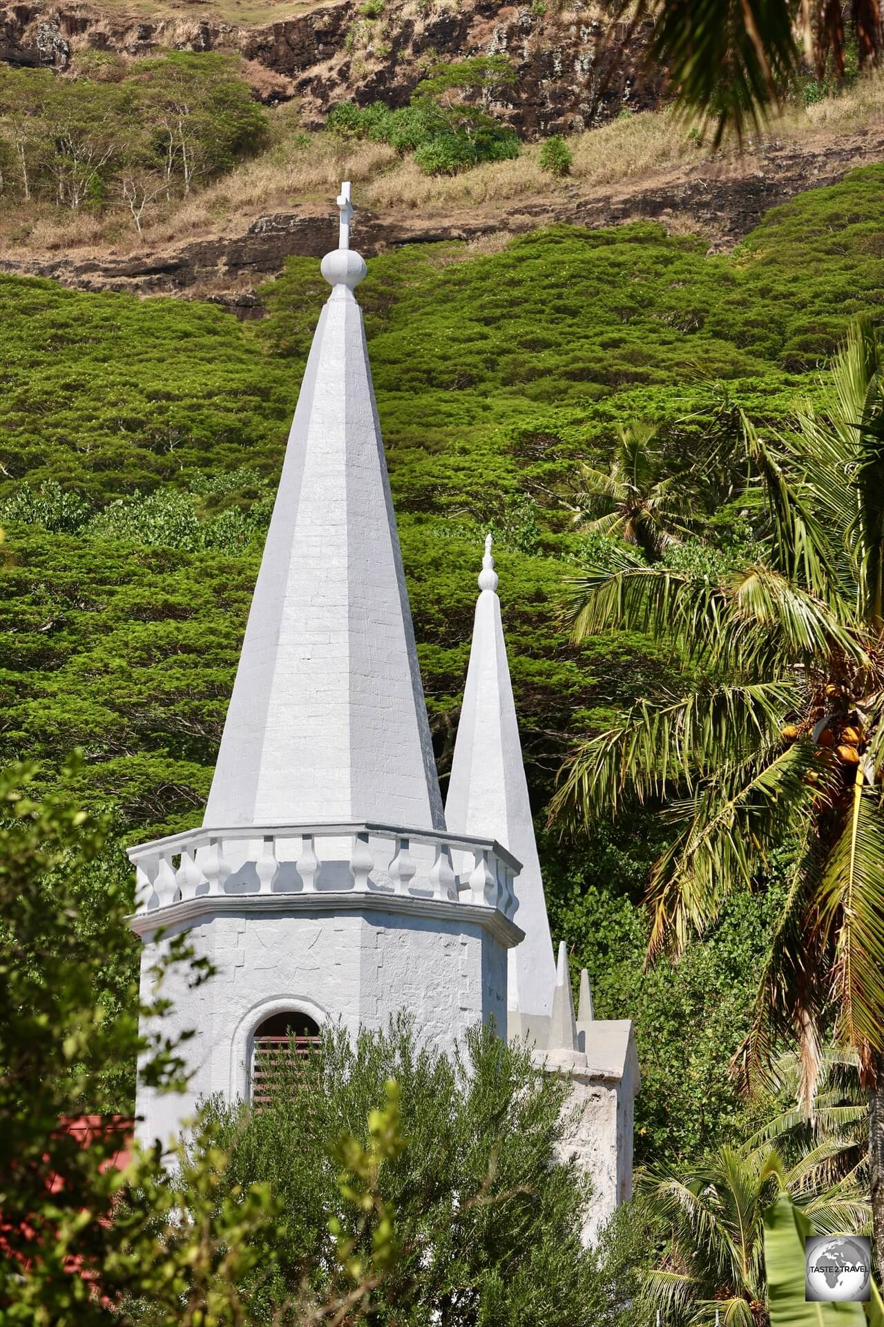 The twin, asymmetrical, spires of <i>Notre-Dame de la Paix</i> church, Akamaru Island.