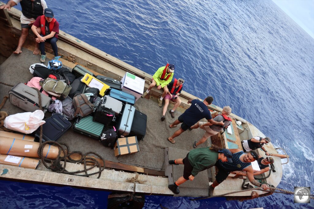 Boarding the "Moss" longboat at sea, for the short transfer to Bounty Bay.