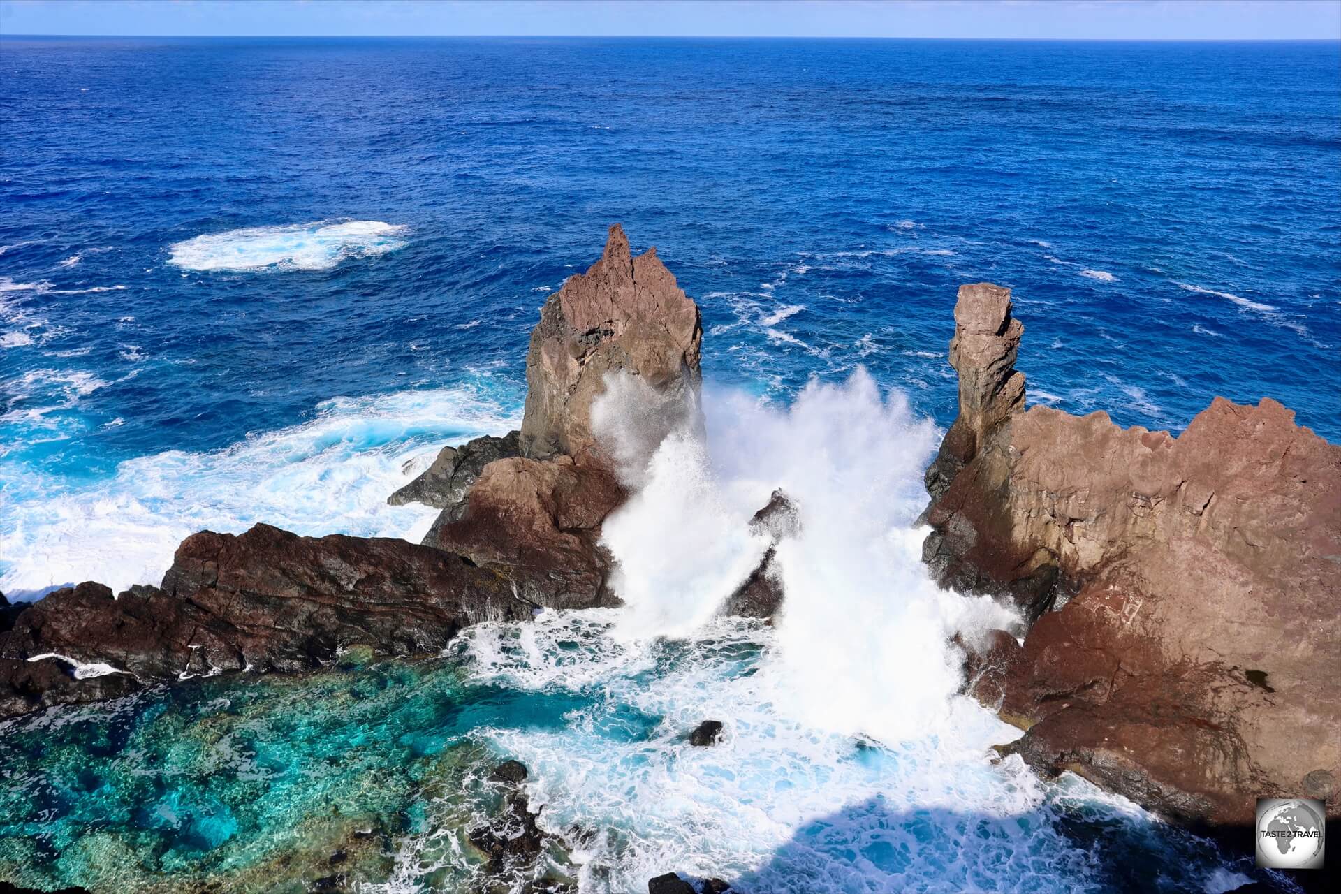 A wave inundates St. Paul's Pool, a natural lava swimming pool. 