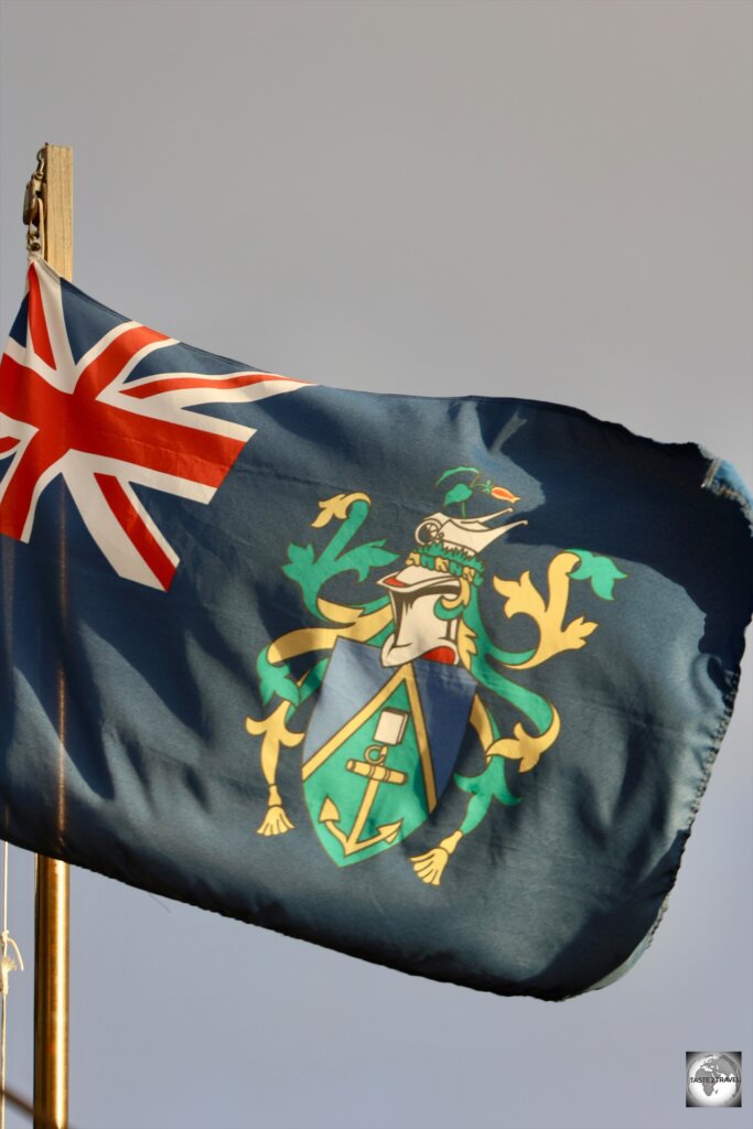 The flag of Pitcairn Islands, flying over the main square in Adamstown.