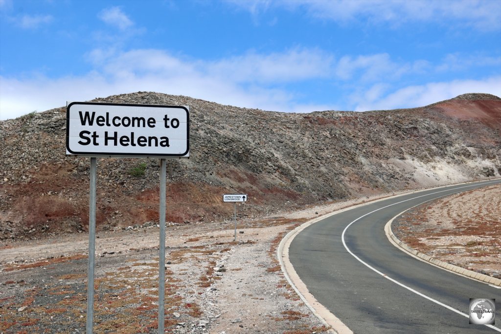 A "Welcome to St Helena" sign, outside St Helena Airport.