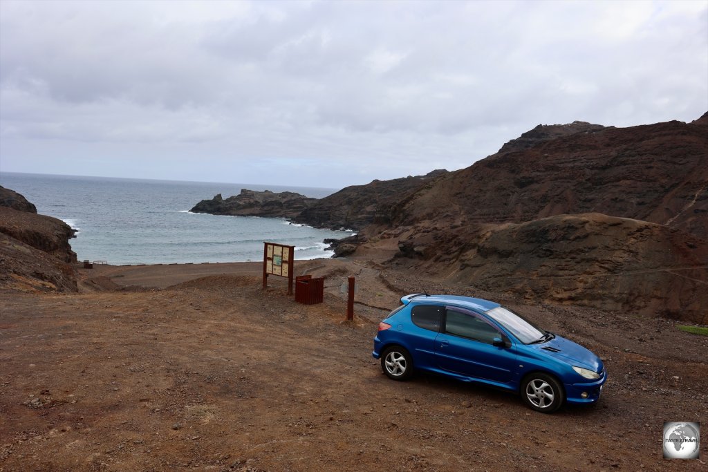 My rental car, parked in the car park at a very empty Sandy Bay.