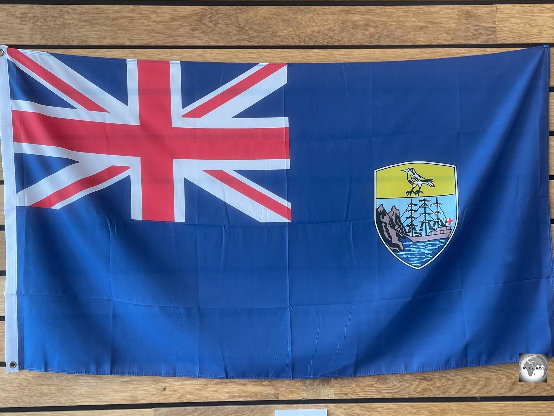 The flag of Saint Helena features the territory's coat of arms.