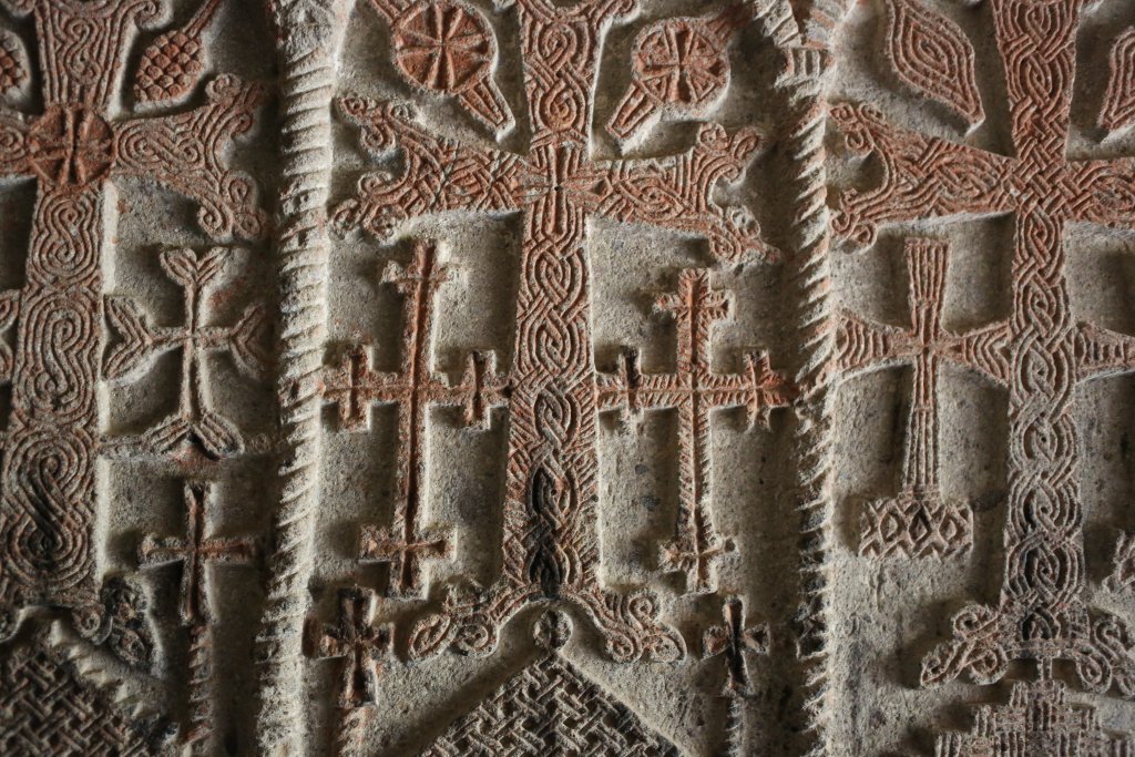 Rock-carved crosses decorate the walls of Geghard monastery.