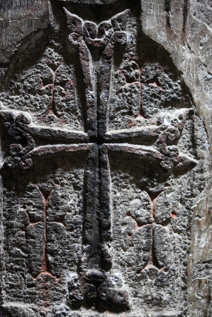 Rock-carved crosses decorate the walls of Geghard monastery.