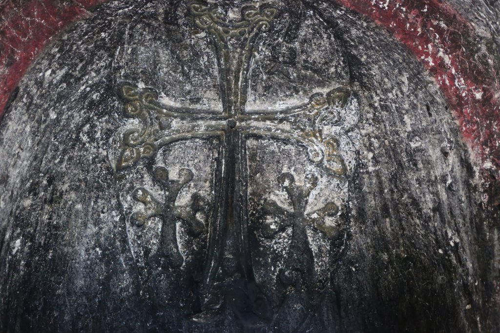 Rock-carved crosses decorate the walls of Geghard monastery.