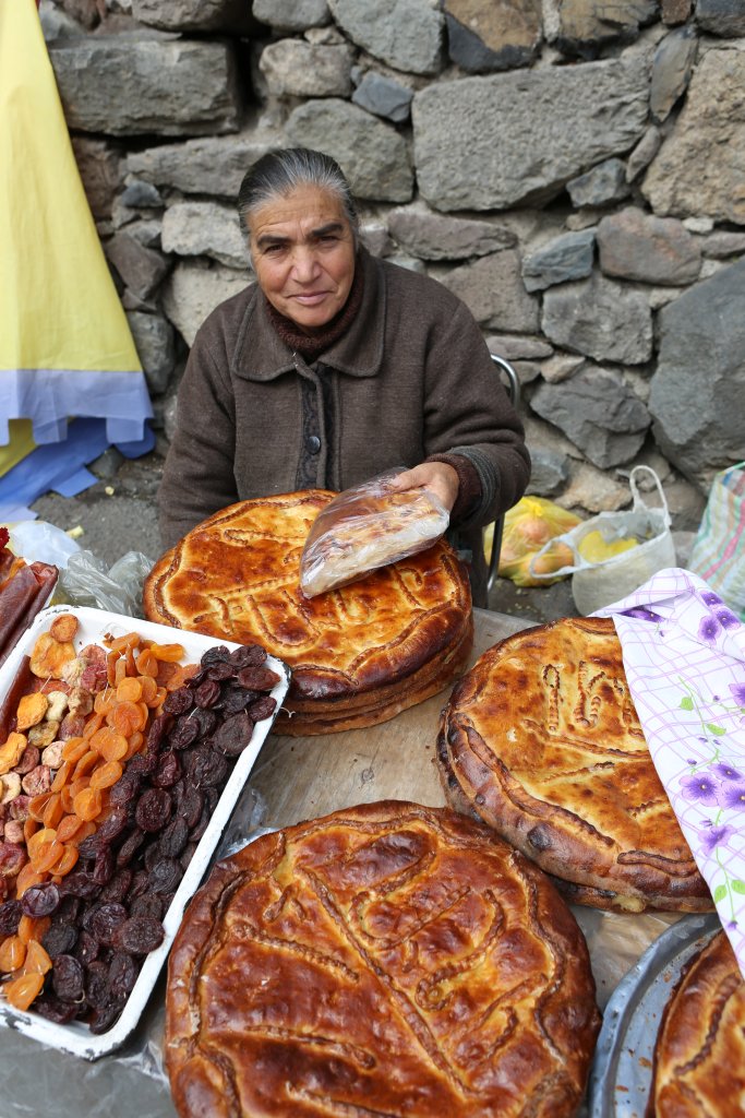 The crusty 'Geghard Gata' is stuffed with a sweet filling (Khoriz) made from a fluffy mixture of flour, butter, and sugar, with a consistency of baked custard.