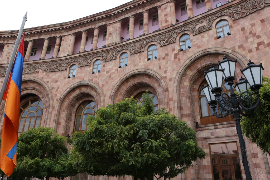 The flag of Armenia and the Armenia Marriott Hotel on Republic Square, the main square in Yerevan.