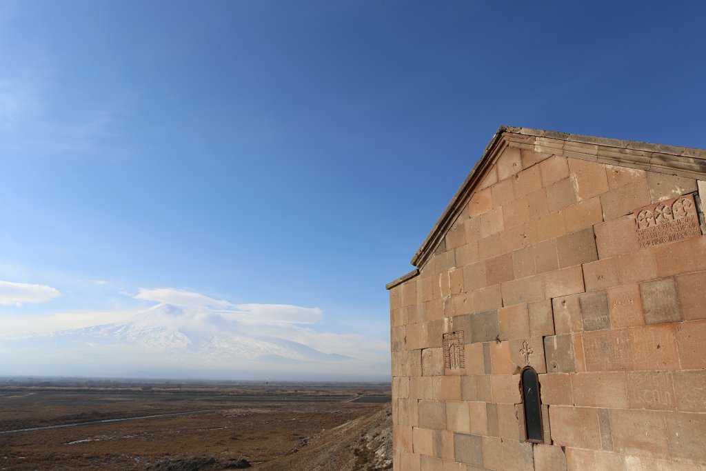 A view into Turkey, and a cloud-covered Mount Ararat, from Khor Virap.