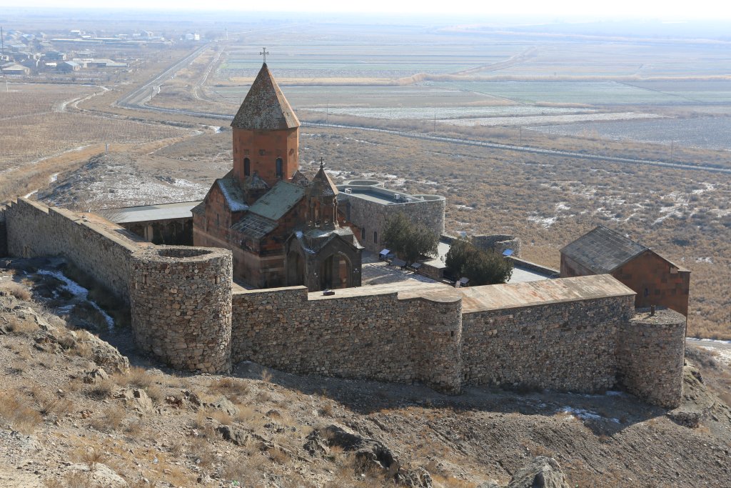 A view of Khor Virap, which is situated just 100 metres away from the closed Turkish-Armenian border (background), which is sealed by barbed wire fencing.