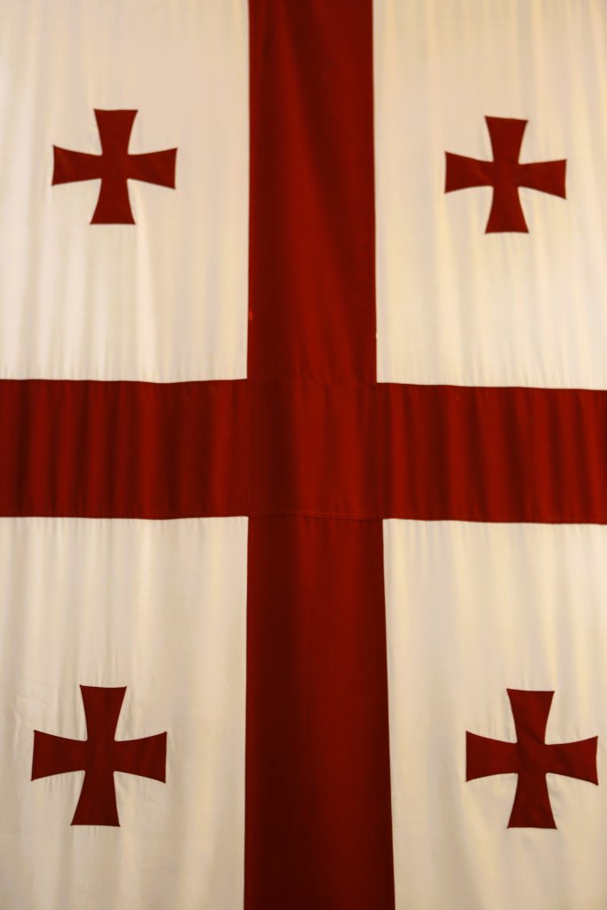 The iconic flag of Georgia, displayed at the Holy Trinity Cathedral of Tbilisi.