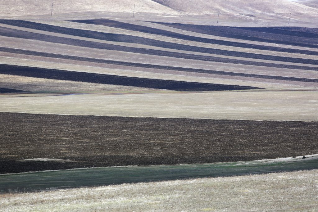 Like an abstract painting, freshly plowed farm fields line the road to the David Gareji Monastery complex in eastern Georgia.