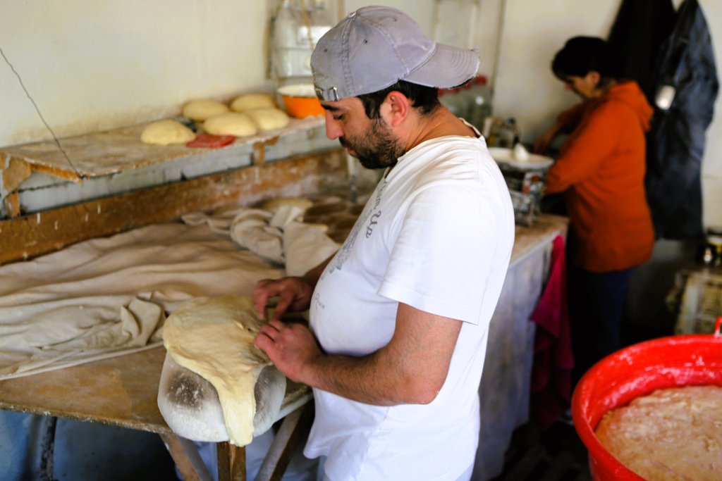A baker, preparing traditional Georgian Lavash bread in Tbilisi.
