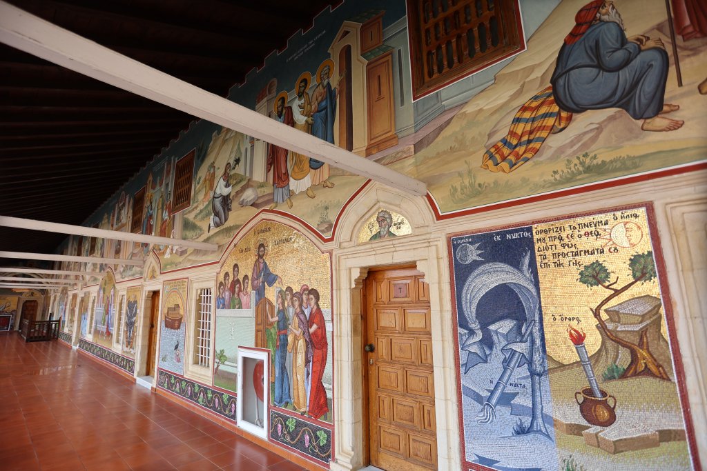 The walls of Kykkos Monastery are adorned with colourful mosaics which depict religious scenes, including the Virgin Mary, Jesus Christ, and Noah's ark.