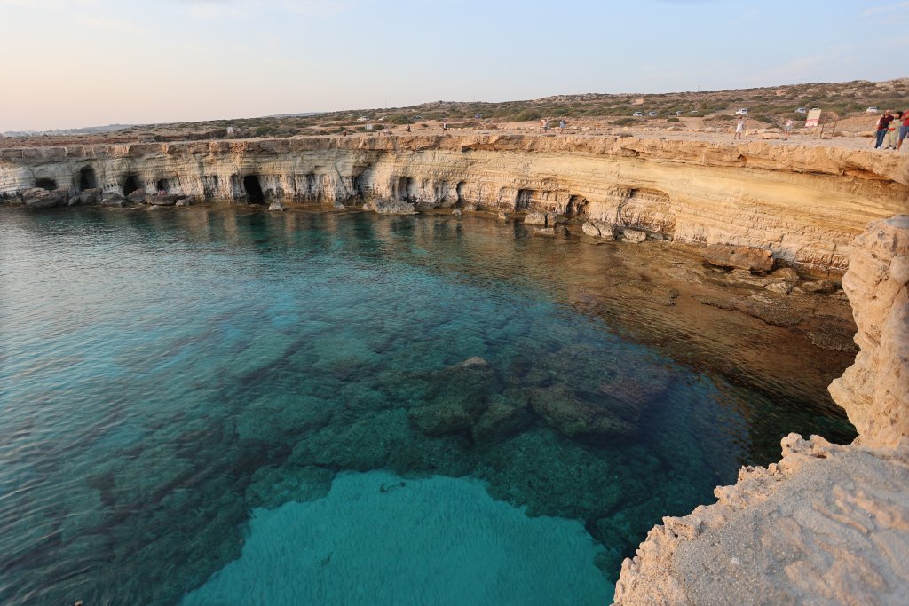 A view of the turquoise water and sea cliffs at the Cavo Greco National Park.