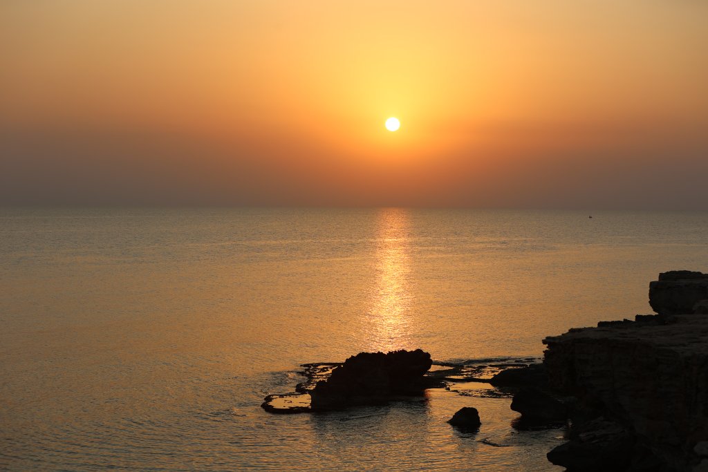 A view of the sunset from the Cavo Greco National Park.