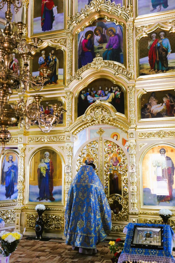 An orthodox priest, in front of the iconostasis of the St. John the Baptist Cathedral in Comrat, Gagauzia.