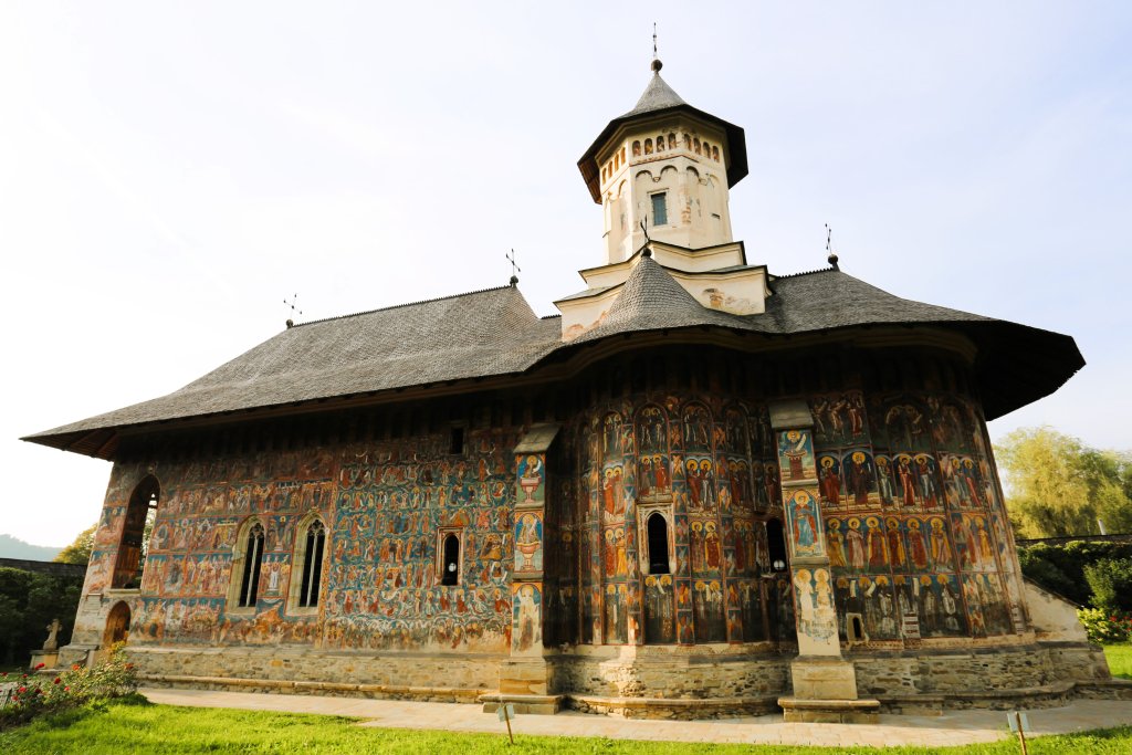 The frescoes that adorn the Moldovița Monastery were painted by Toma of Suceava in 1537. They are filled with yellow and blue accents and are well preserved.