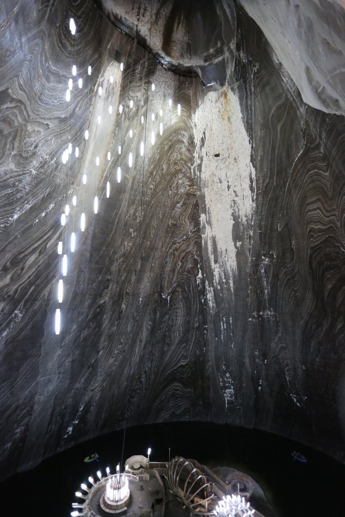 A view of the 90-metre (295 ft) deep, bell-shaped, chamber of the Terezia Mine at Salina Turda, which features a plunging "cascade of salt".